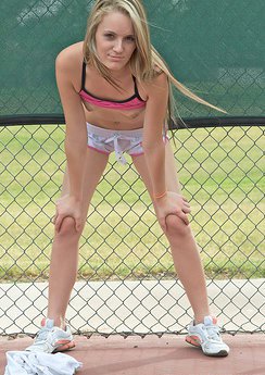 Beautiful blond teen with tiny boobs shows off her body on the tennis court